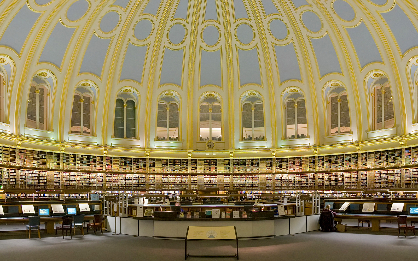 British Museum Reading Room interior with circular bookshelves and domed ceiling, London.